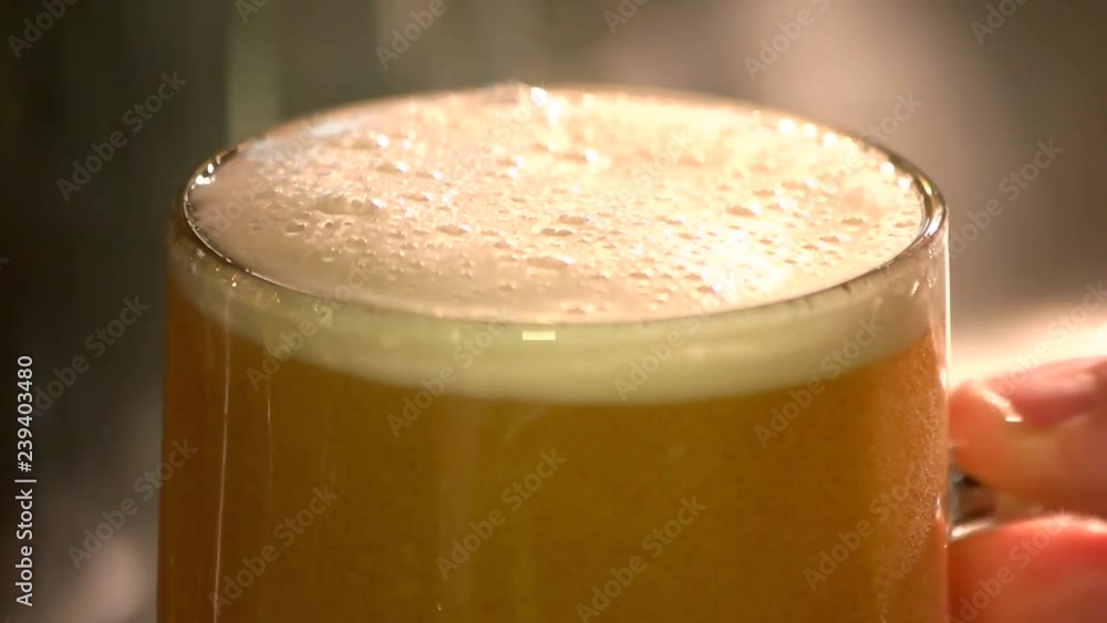 Extreme close up thick draft ale, slow-motion. Turbid ale glass, macro. Extreme close up thick draft ale, slow-motion. Turbid ale glass, macro.