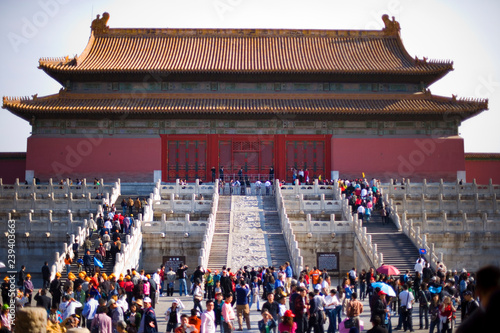 Crowd of people gathered outside an ancient temple. photo