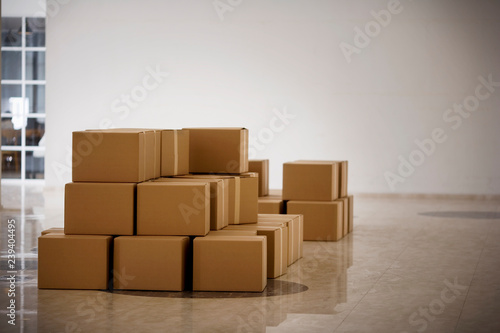 Boxes laying in a lobby.