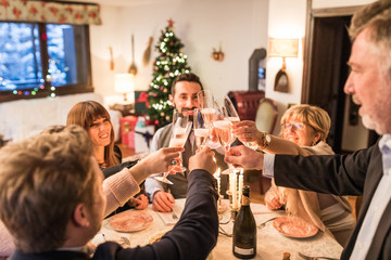 Family toasting and celebrating Christmas and New Year