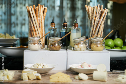 Italian Antipasto table setting with bread sticks and cheese