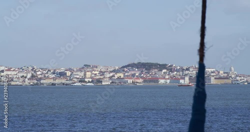 Transportation boat crossing Lisbon river. This boat crosses everyday from Almada to Lisbon carrying thousands of people . photo