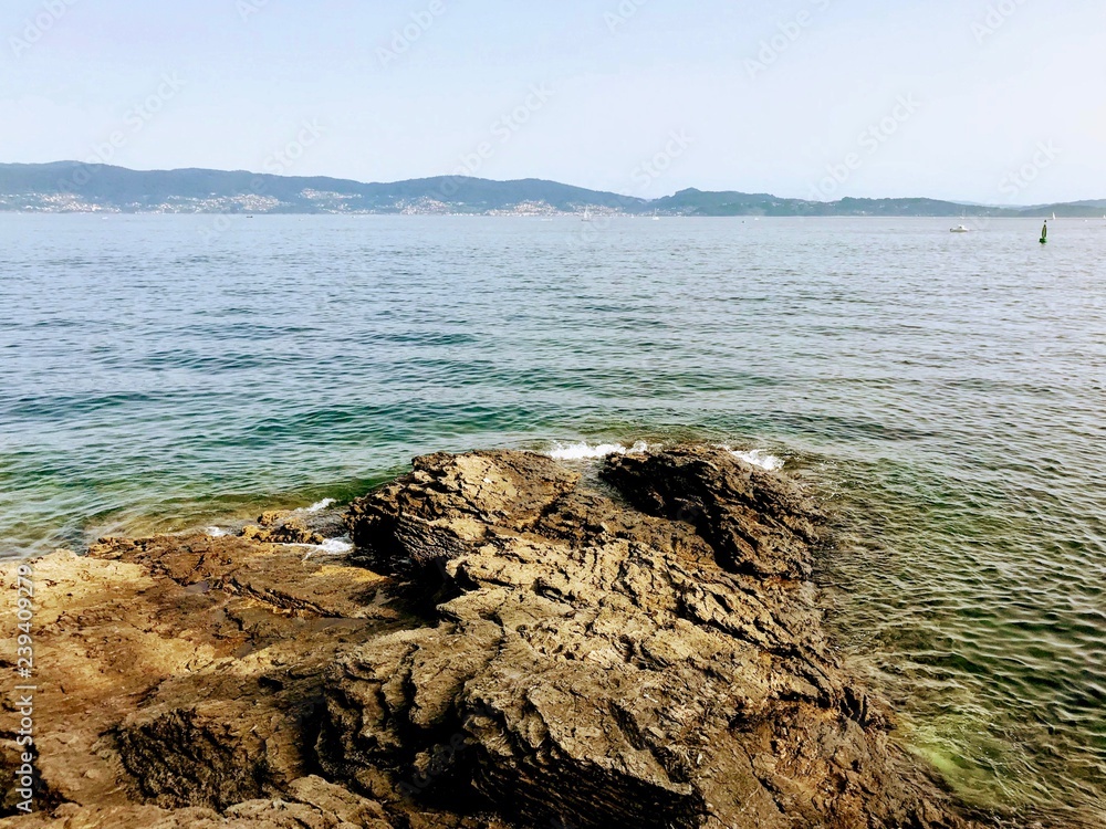 View of the ocean from above the rocks in Sanxenxo Galicia Spain