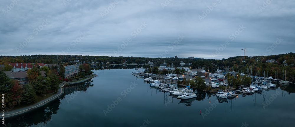 Aerial panoramic view of Melville Cove in the Modern City during a cloudy sunrise. Taken in Armdale, Halifax, Nova Scotia, Canada. Aerial panoramic view of Melville Cove in the Modern City during a cloudy sunrise. Taken in Armdale, Halifax, Nova Scotia, Canada.