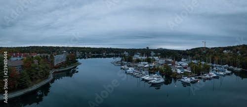 Aerial panoramic view of Melville Cove in the Modern City during a cloudy sunrise. Taken in Armdale, Halifax, Nova Scotia, Canada.
