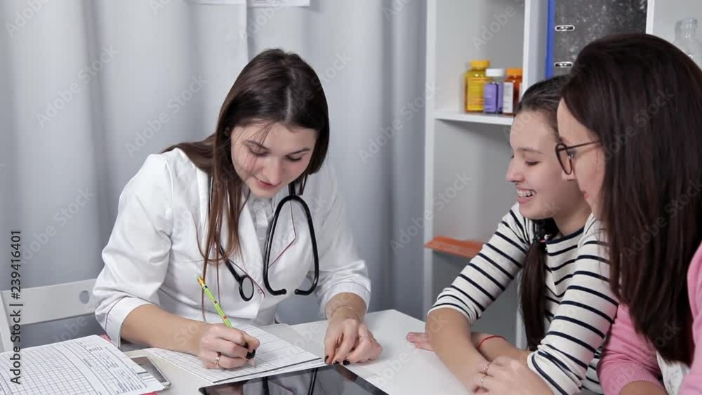 Doctor talking to young child and mother Doctor talking to young child and mother
