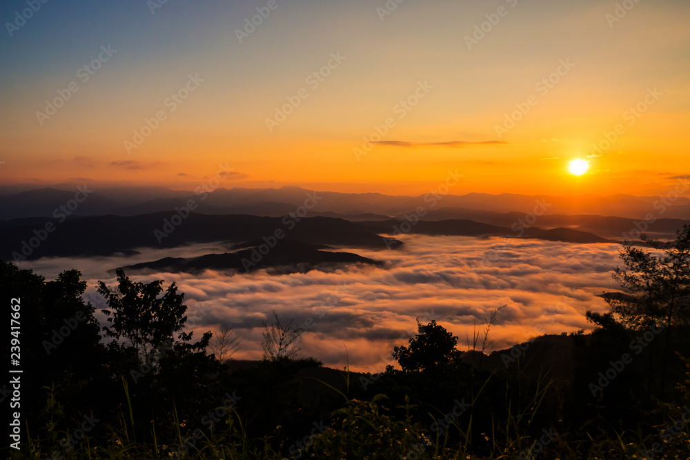  sunset overlooking mountains with Mist