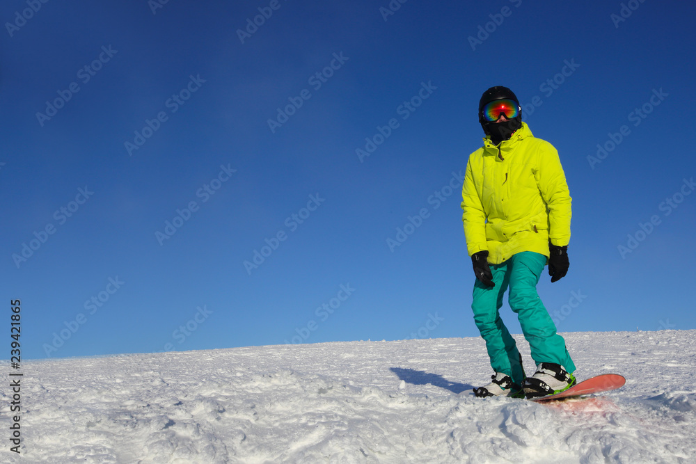Snowboarder riding on slope
