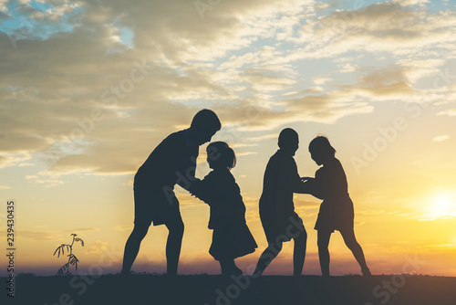 Silhouette of children playing