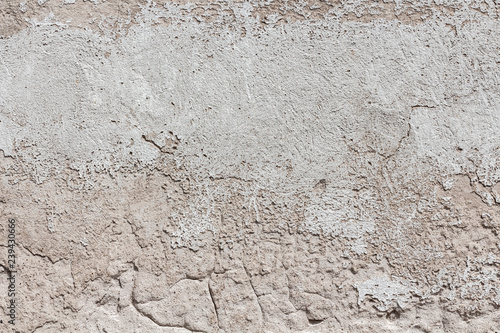 Ancient wall with peeling plaster. Old concrete wall textured background