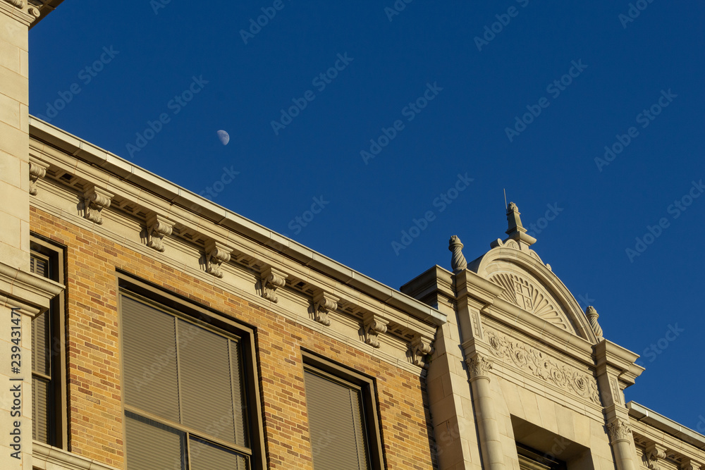 moon above facade of building