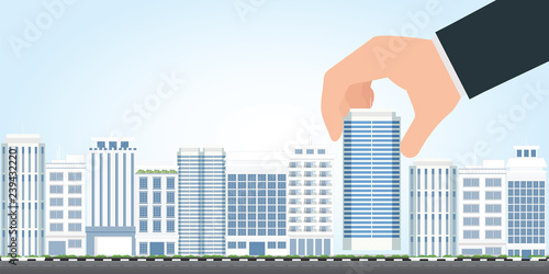 Businessman select to holding modern building.