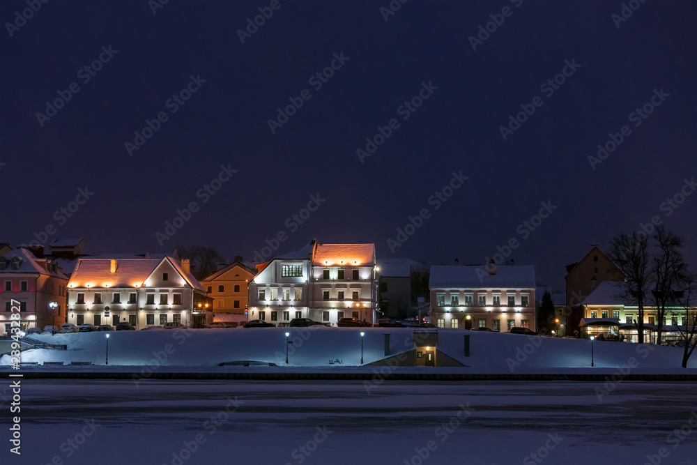 Empty illuminated street at night. Picturesque panoramic view of the Old Town of Minsk