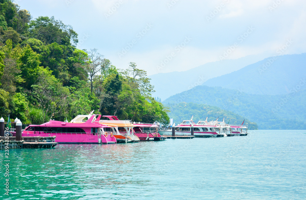 colorful travel boats parking at  the pier, sun moon lake, Nontou, Taiwan