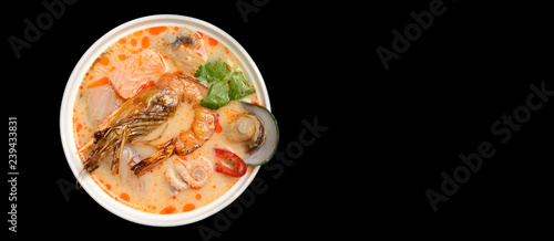 Tom yam kong or Tom yum spicy Thailand Dish Cuisine soup with king prawn chili pepper and mashrooms
