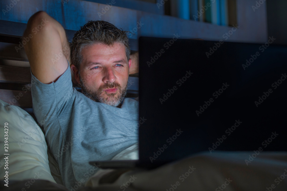 Sex Pics Sleeping - man alone in bed playing cybersex using laptop computer watching porn sex  movie late at night with lascivious pervert face expression in internet  pornographic sexual content foto de Stock | Adobe Stock