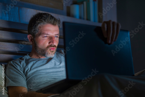 Принти на полотні man alone in bed playing cybersex using laptop computer watching porn sex movie
