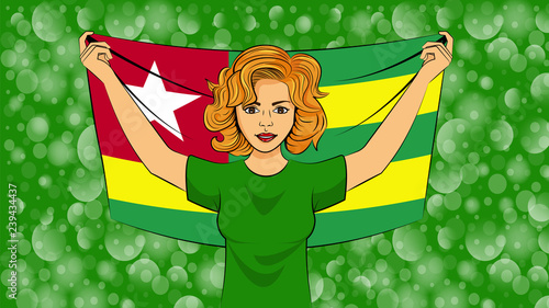 Blonde girl holding a national flag of Togo
