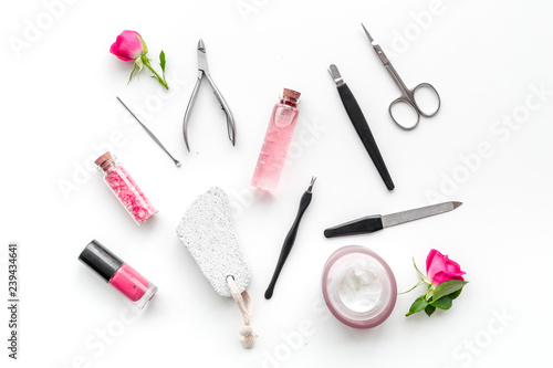 tools for manicure with spa salt and rose on white background top view