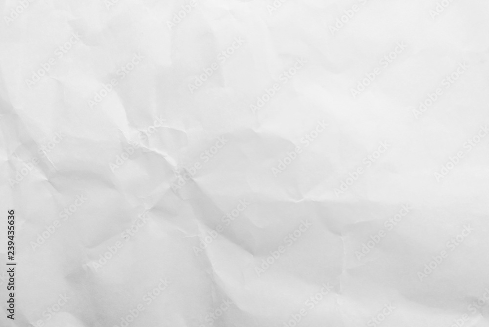 Obraz premium White crumpled paper texture background. Close-up.