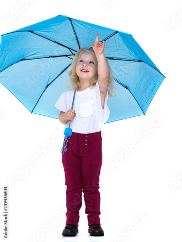 Little girl under an umbrella.