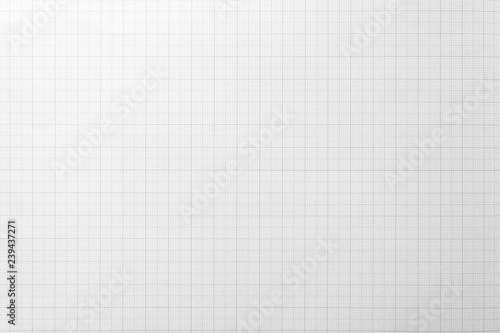 White paper with grid line pattern for background. Close-up.