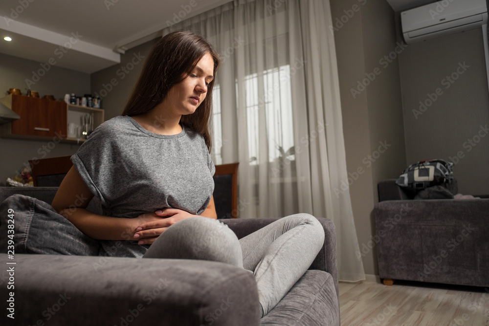 young woman has pain in right hypochondrium, young woman has a stomachache, gallbladder disease young woman has pain in right hypochondrium, young woman has a stomachache, gallbladder disease