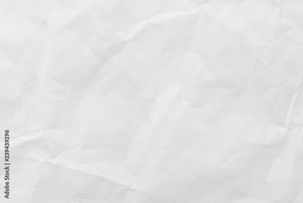 White crumpled paper texture background. Close-up. White crumpled paper texture background. Close-up.