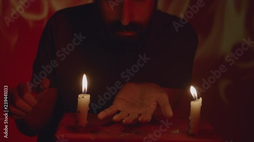 Man lighting hand on fire 60fps slow motion 4 medium close photo