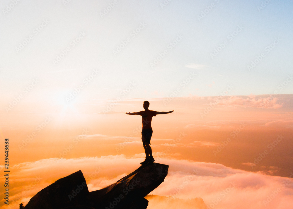 silhouette of man on top of mountain silhouette of man on top of mountain