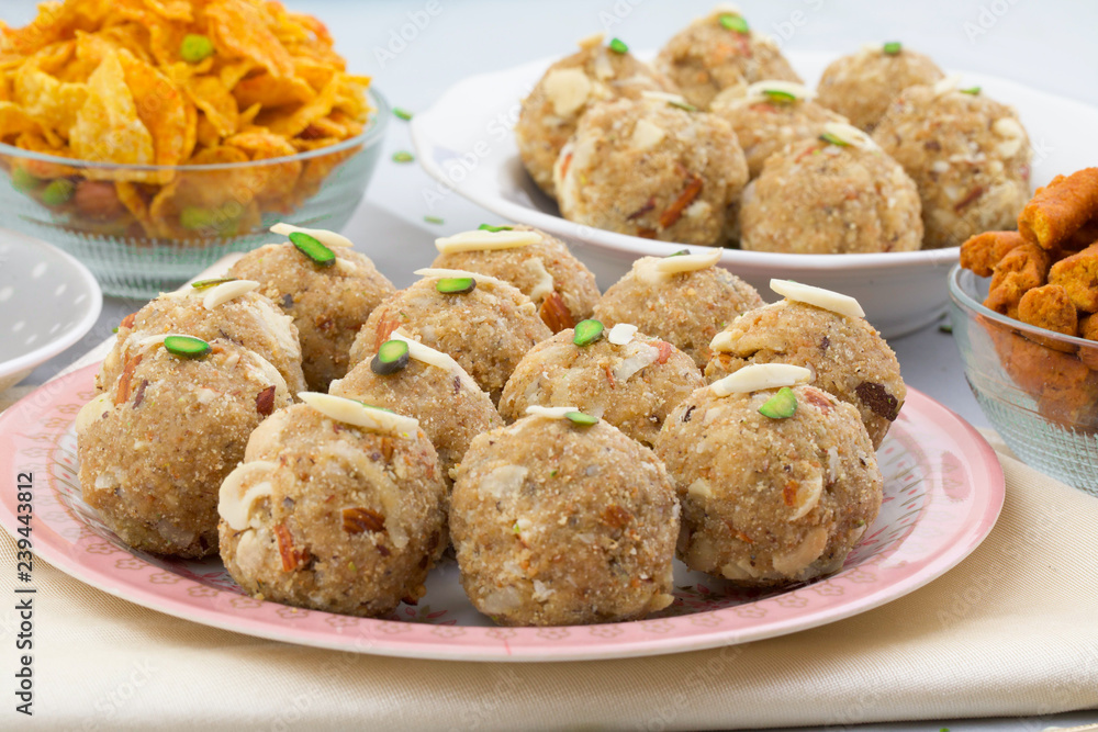 Indian Traditional Sweet Food Urad Dal Laddu Also Know as Laddoo, Ladoo, Laddo are Ball-Shaped Sweets Made of Butter, Dry Fruits, Fenugreek and other Spices. Urad Dal laddu Sweet Mostly Eat in Winter Indian Traditional Sweet Food Urad Dal Laddu Also Know as Laddoo, Ladoo, Laddo are Ball-Shaped Sweets Made of Butter, Dry Fruits, Fenugreek and other Spices. Urad Dal laddu Sweet Mostly Eat in Winter