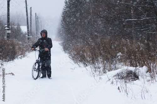 Extreme travel by bicycle in the winter forest.