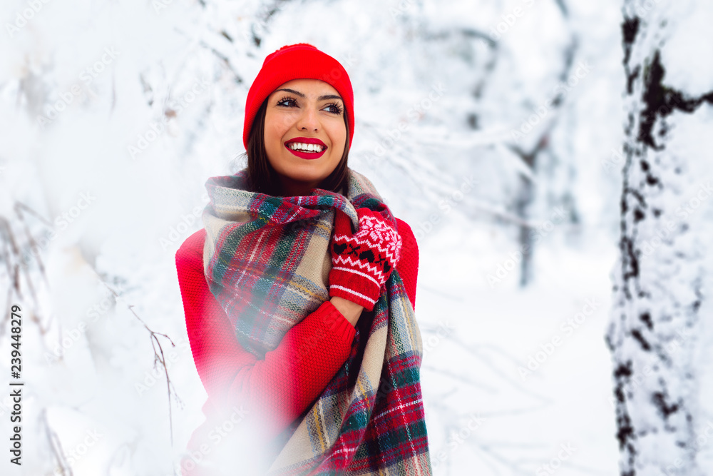 Beautiful woman standing among snowy trees in winter forest - Image Beautiful woman standing among snowy trees in winter forest - Image