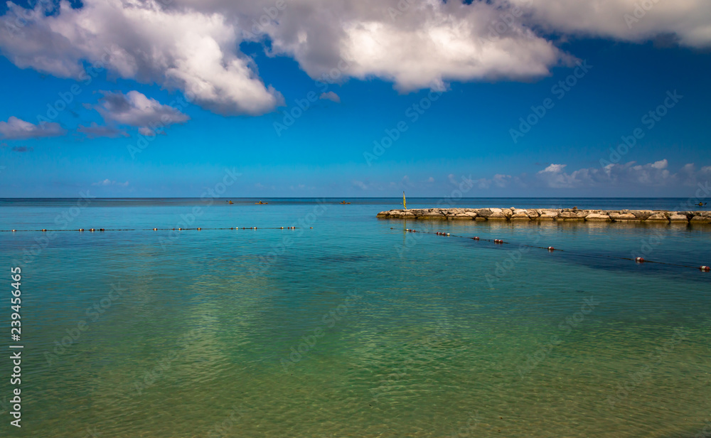 Jamaica island, Montego Bay, Caribbean Sea. Exposure done by the sea of a beach in Montego, Bay, Jamaica, with beautiful water and clouds.