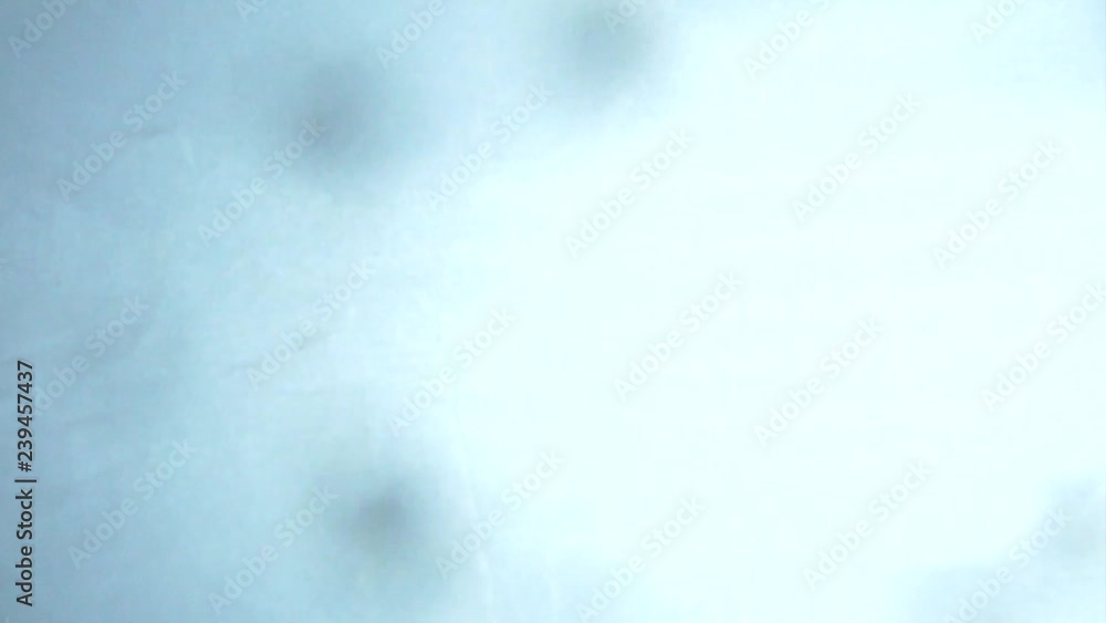 Crystals of salt falling down on the white background Crystals of salt falling down on the white background