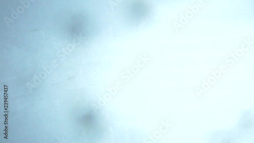 Crystals of salt falling down on the white background photo