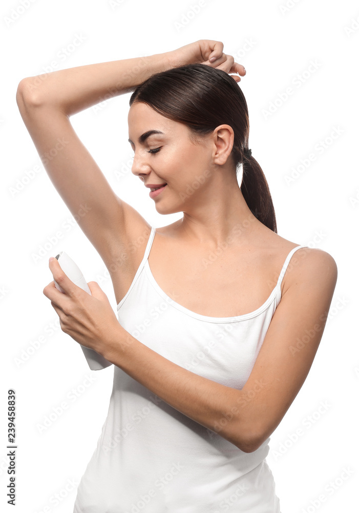 Young woman using deodorant on white background Young woman using deodorant on white background