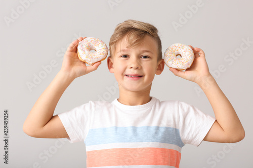 Cute little boy with donuts...