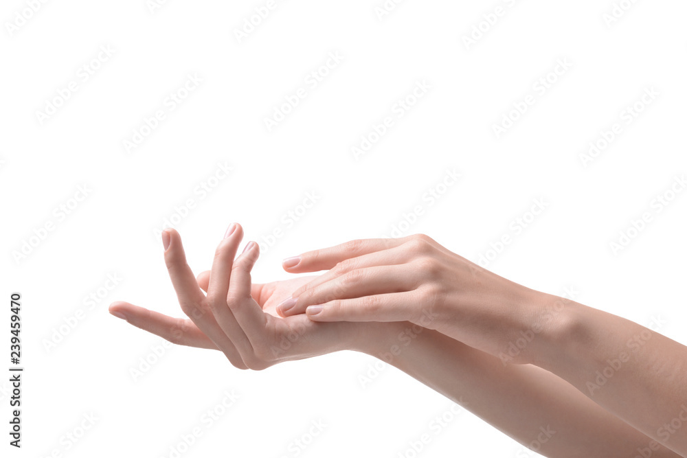 Hands of woman with soft skin after applying cream on white background