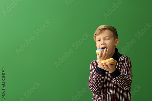 Cute little boy with donuts...