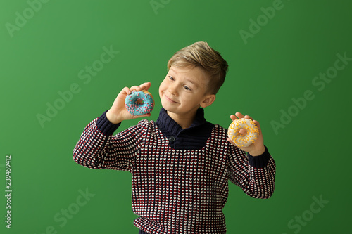 Cute little boy with donuts...