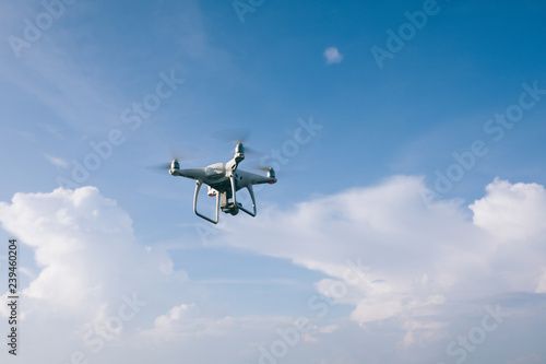 Fototapeta Naklejka Na Ścianę i Meble -  Flying drone which taking photo over sea