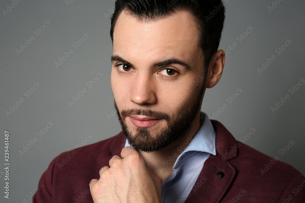 Fototapeta premium Fashionable young man on grey background