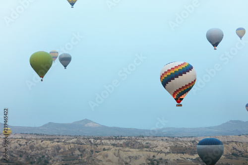 Ballooning In Nature. Hot Air Balloons Flying Above Valley © puhhha