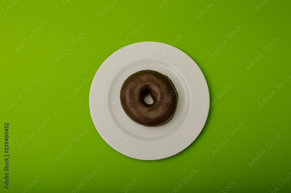 chocolate donuts on a plate chocolate donuts on a plate