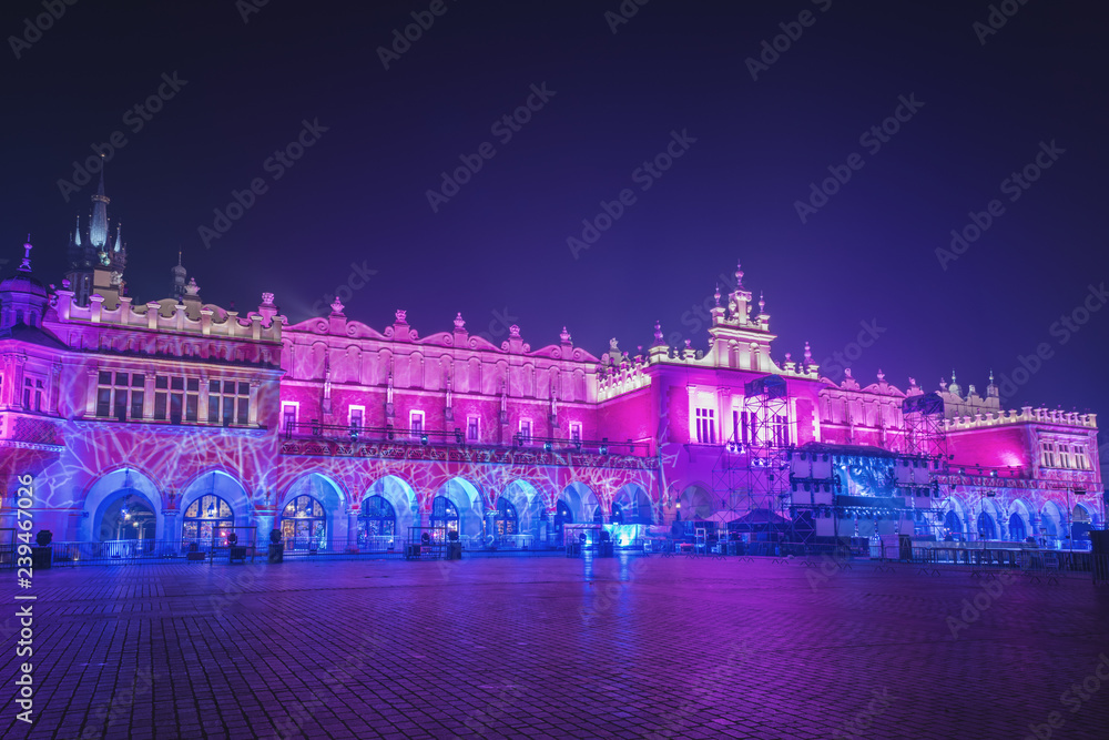 Krakow old town, Market square with Cloth Hall (Sukiennice) in Christmas and New Year lights decoration, historical center cityscape, Poland, Europe