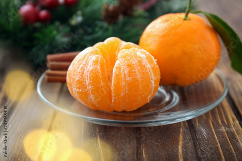 Tasty juicy tangerines on wooden table