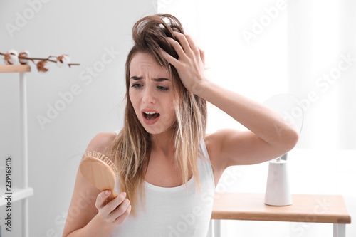 Slika na platnu Woman with hair loss problem at home