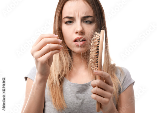 Woman with hair loss problem on white background photo