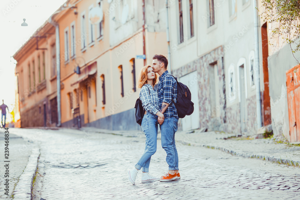 Romantic couple embracing on the street of old city